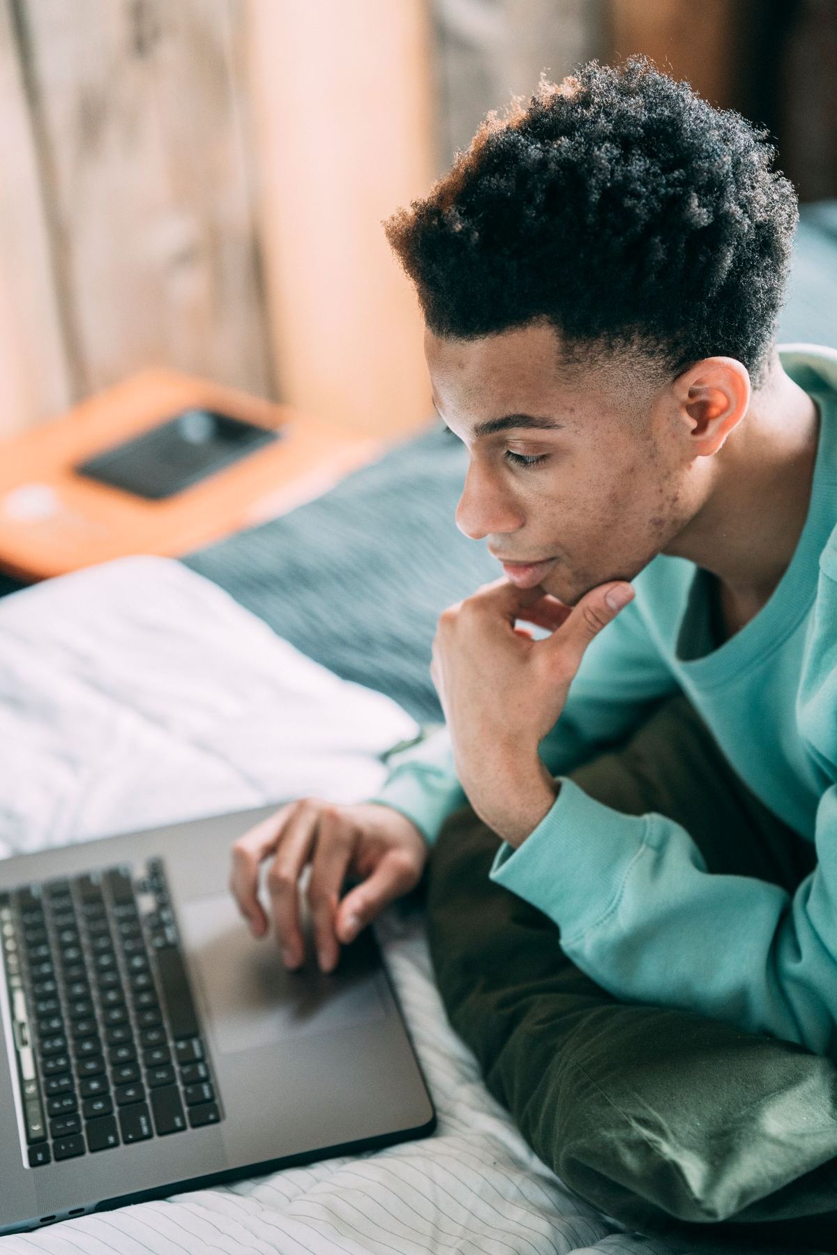 Driver studying CDL practice questions on a laptop